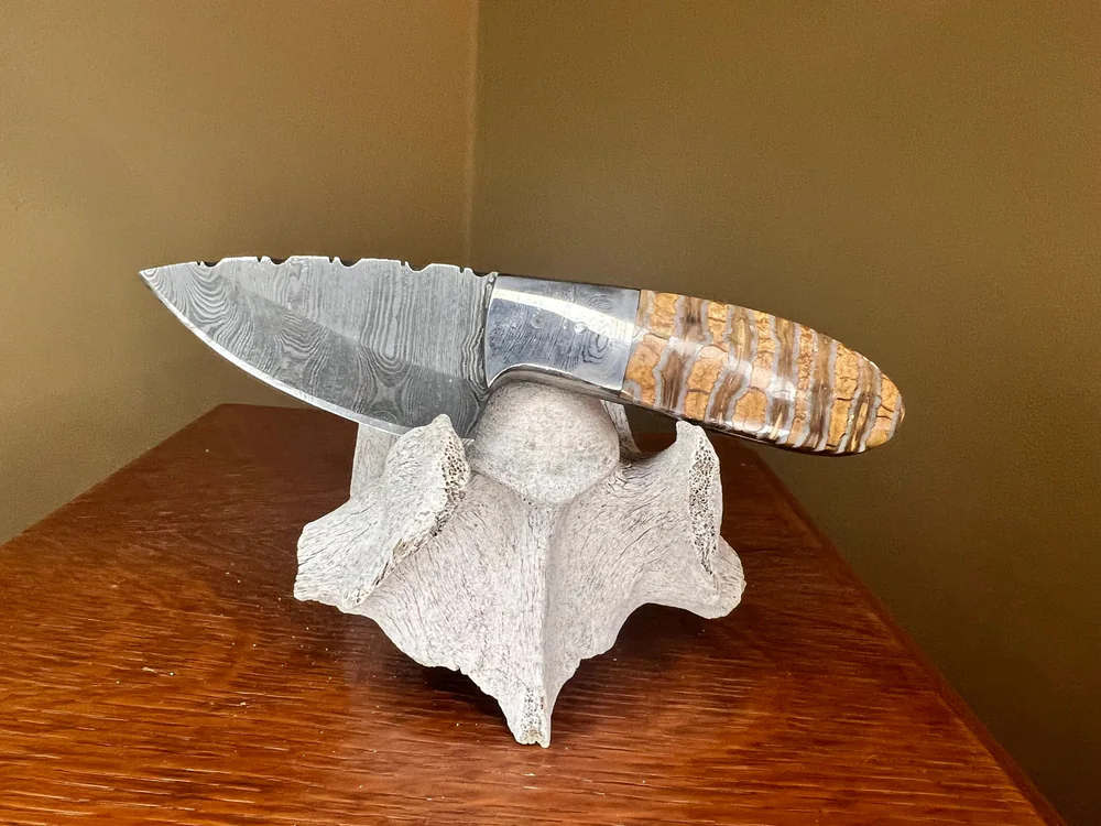 Finished knife with a patterned mammoth tooth handle